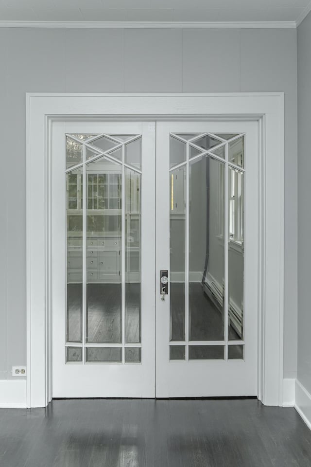 doorway to outside featuring french doors, crown molding, and dark hardwood / wood-style flooring