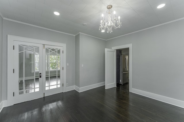 unfurnished room featuring french doors, dark hardwood / wood-style floors, and ornamental molding