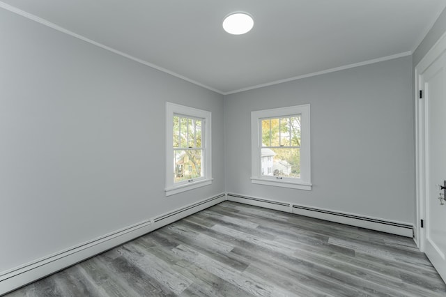 unfurnished room featuring light hardwood / wood-style floors, crown molding, and a baseboard radiator