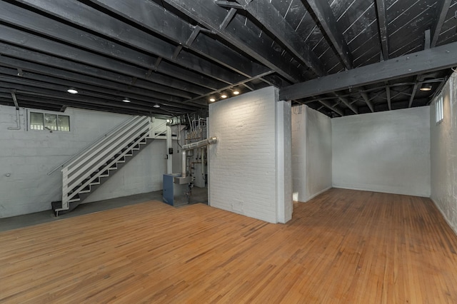 basement with wood-type flooring