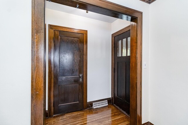 entryway featuring wood finished floors and baseboards
