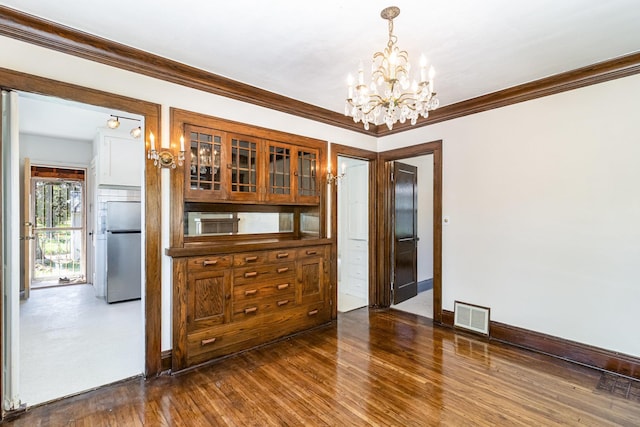 dining area with a chandelier, crown molding, dark wood-style floors, and baseboards