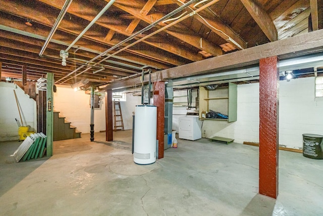 basement featuring gas water heater, washer / dryer, and stairs