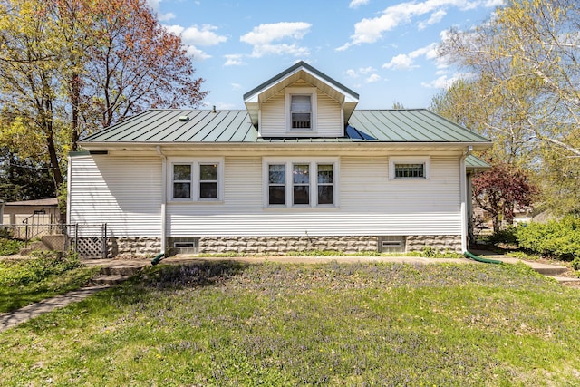 back of property with a standing seam roof and metal roof