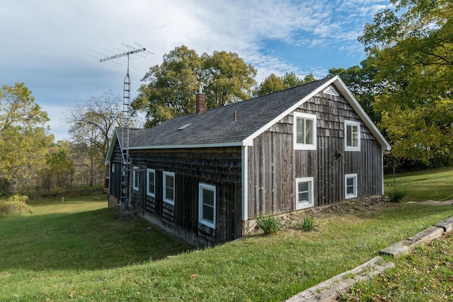 view of side of property with a yard