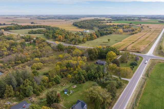 birds eye view of property with a rural view