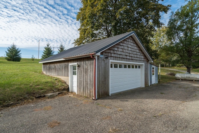 garage featuring a yard