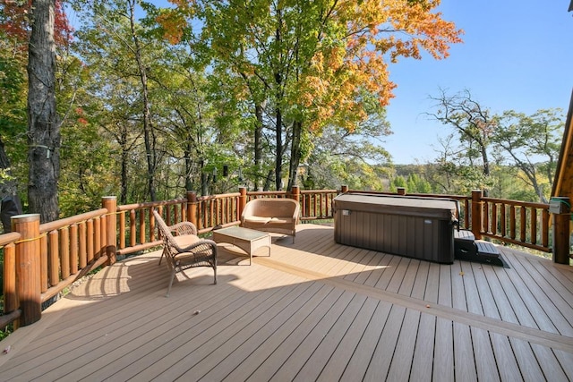 wooden deck with a hot tub