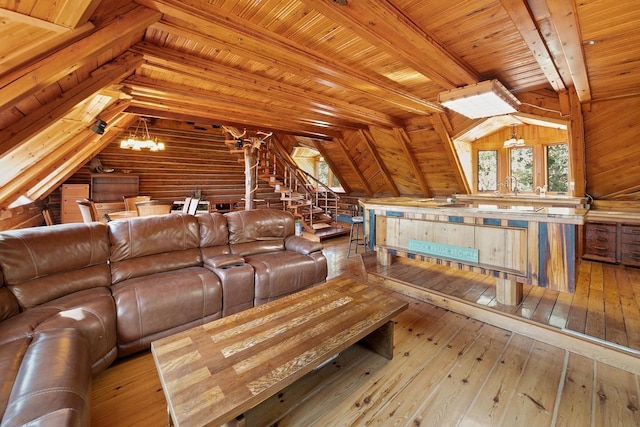 unfurnished living room with vaulted ceiling with beams, wood walls, light hardwood / wood-style flooring, a chandelier, and wooden ceiling