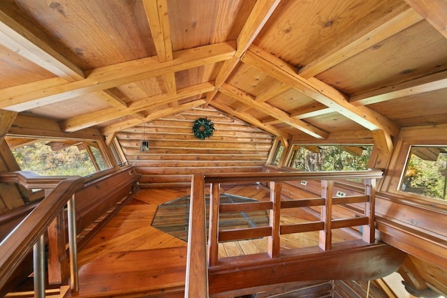 interior space featuring hardwood / wood-style flooring, wood ceiling, and a healthy amount of sunlight