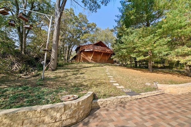 view of yard featuring a patio and a fire pit