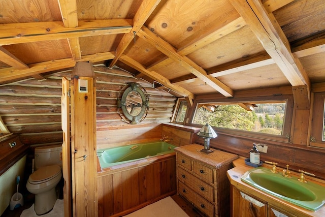 full bath featuring lofted ceiling with beams, wooden ceiling, a garden tub, toilet, and rustic walls