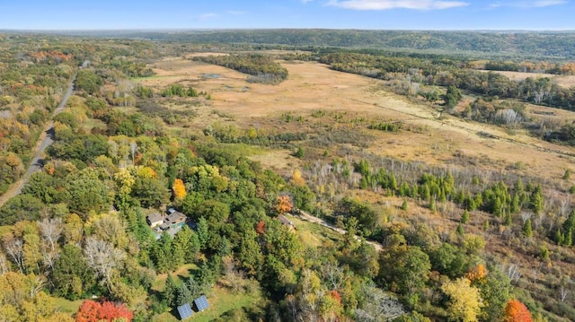 drone / aerial view featuring a forest view