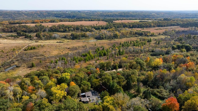 aerial view featuring a wooded view