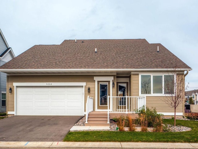 view of front of house with a porch and a garage