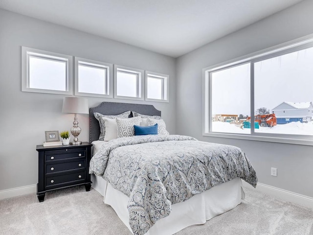 bedroom featuring light carpet