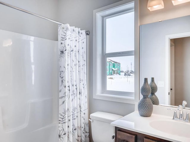 full bathroom with vanity, toilet, and shower / bath combo