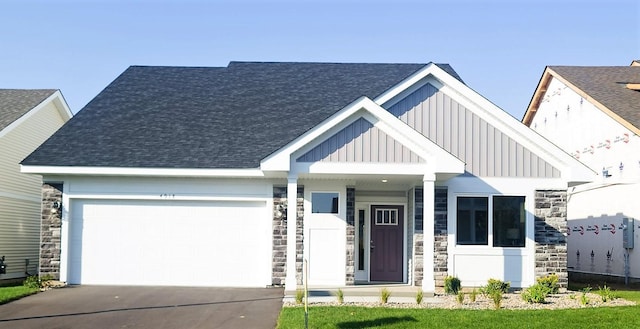 view of front facade featuring covered porch and a garage