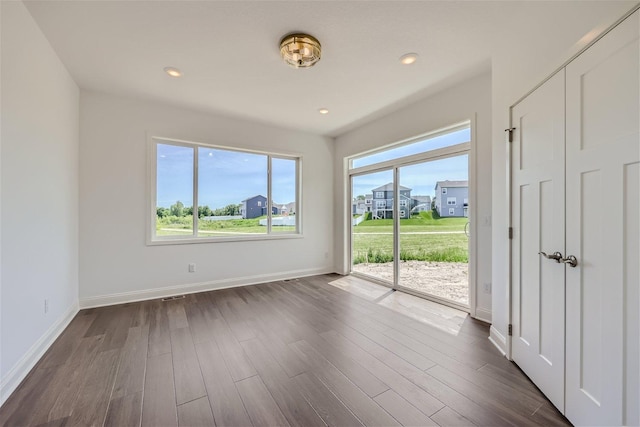 empty room featuring dark wood-type flooring