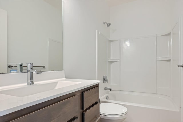 full bathroom featuring vanity, toilet, and washtub / shower combination