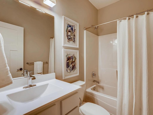 full bathroom featuring shower / bath combo, vanity, and toilet