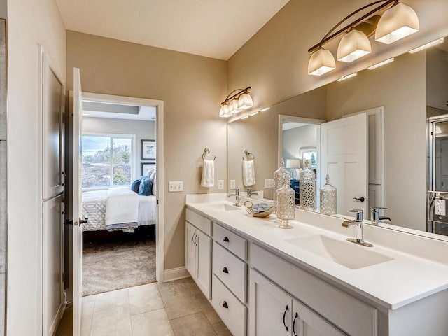 bathroom with vanity and tile patterned flooring