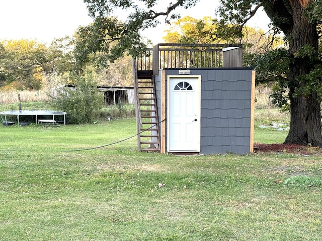 view of outbuilding with a yard