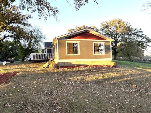 view of property exterior featuring a wooden deck