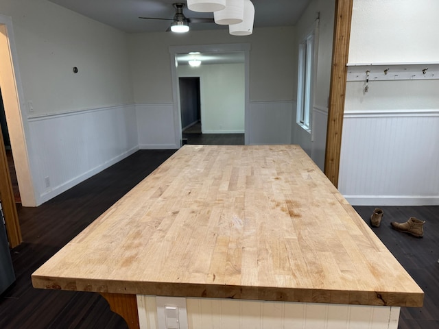 kitchen with dark wood-type flooring and ceiling fan