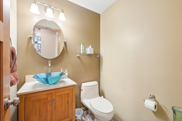 bathroom with toilet and vanity