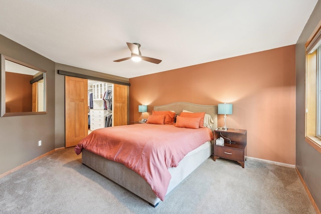 bedroom with light carpet and ceiling fan