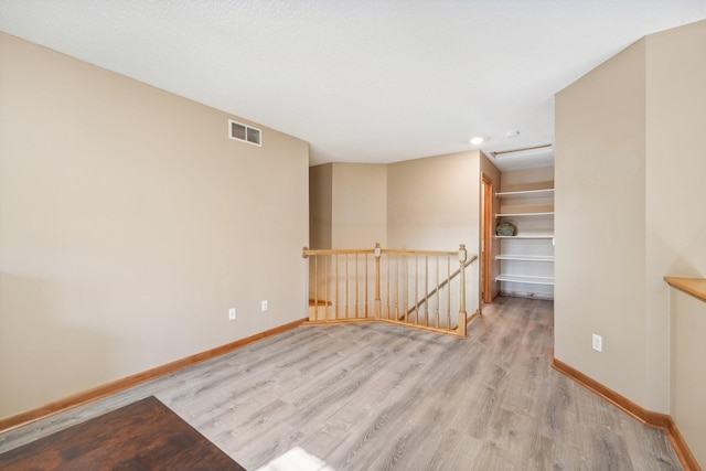 empty room with light wood-type flooring