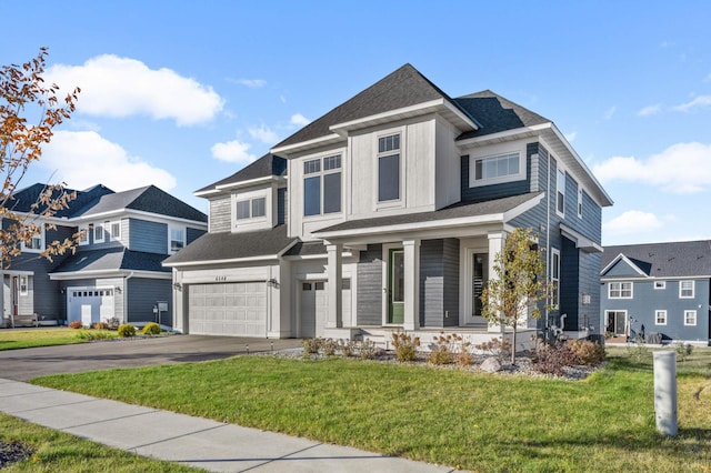 view of front facade featuring a garage and a front yard