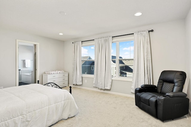 carpeted bedroom featuring connected bathroom