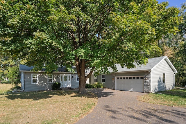 view of front of property featuring a garage and a front yard