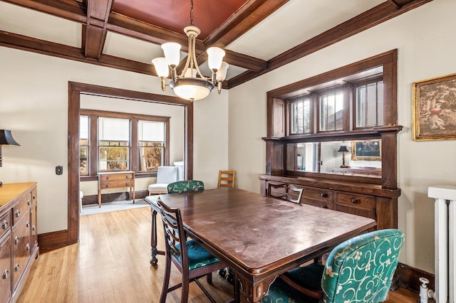 dining room featuring light hardwood / wood-style flooring, coffered ceiling, a chandelier, and beam ceiling