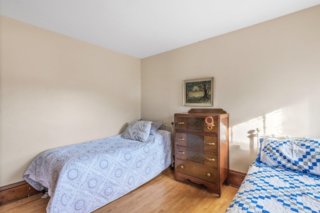 bedroom with wood-type flooring