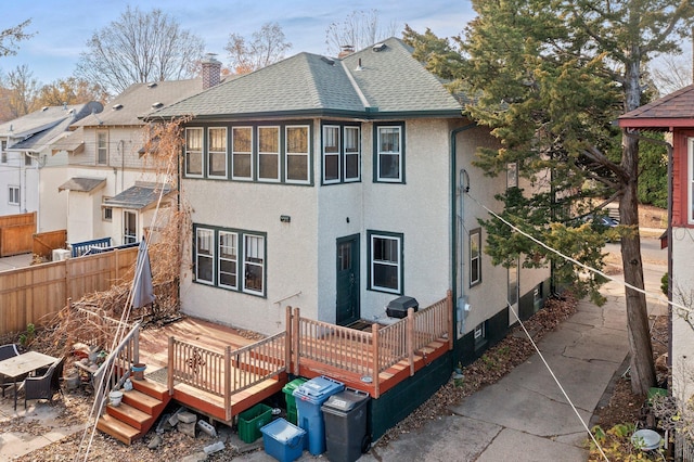 back of house with a wooden deck