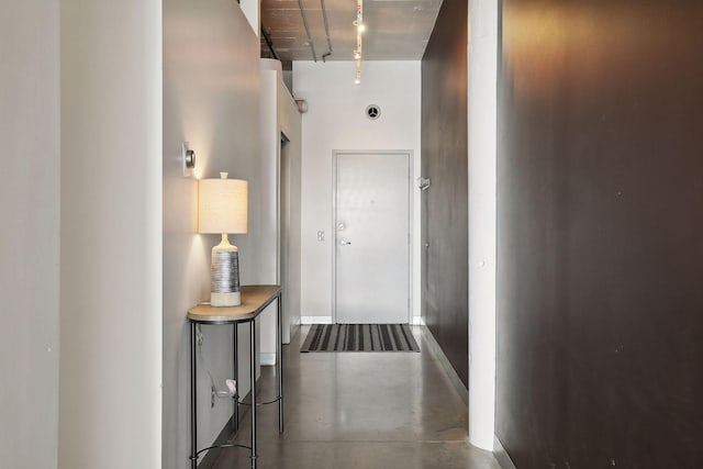 hallway featuring concrete flooring