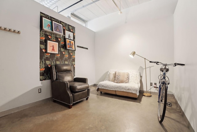 living area featuring concrete floors