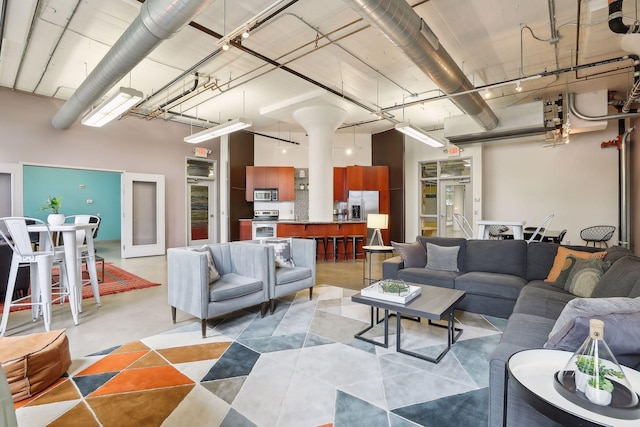 living room with a high ceiling