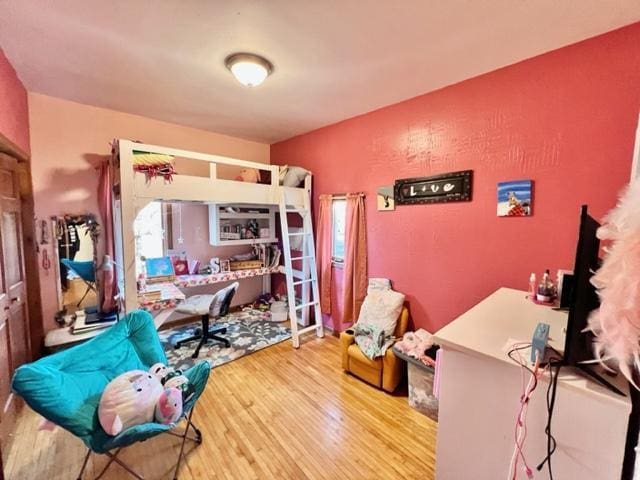 bedroom featuring wood-type flooring