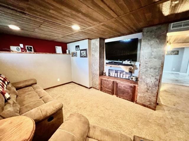 carpeted living room featuring wood ceiling