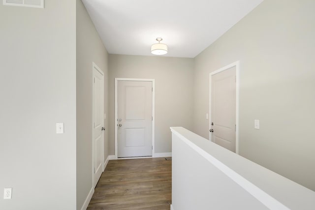 hallway featuring dark hardwood / wood-style floors