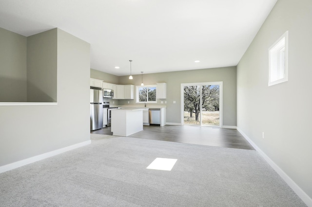 unfurnished living room featuring carpet floors