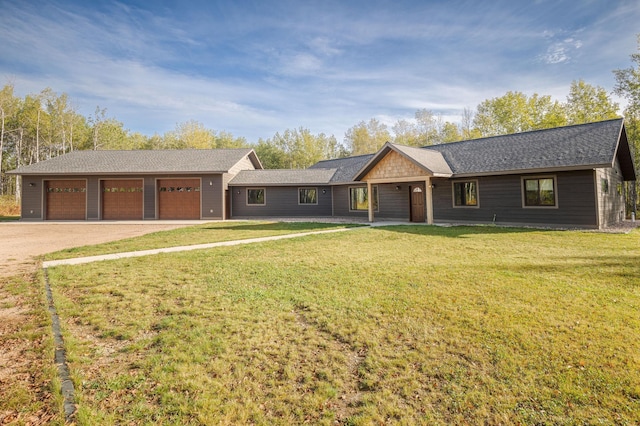 ranch-style house with a front yard and a garage