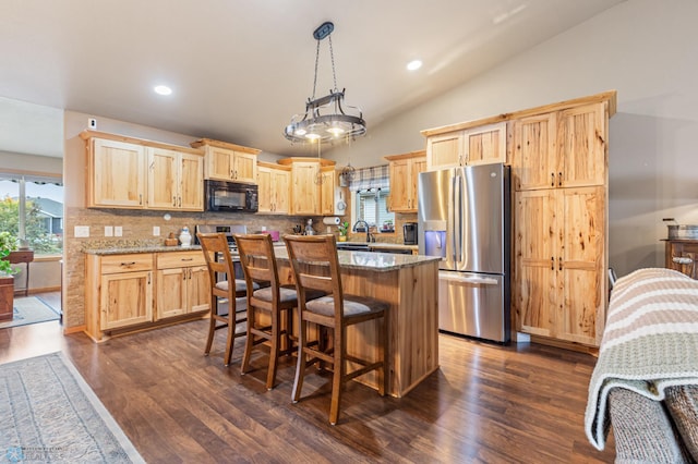 kitchen with lofted ceiling, light brown cabinets, stainless steel refrigerator with ice dispenser, dark stone counters, and dark hardwood / wood-style flooring