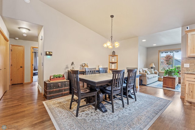 dining room featuring a chandelier and dark hardwood / wood-style flooring