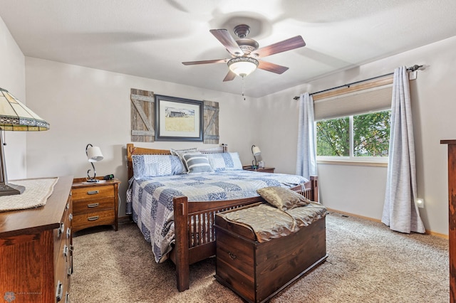 bedroom featuring ceiling fan and carpet