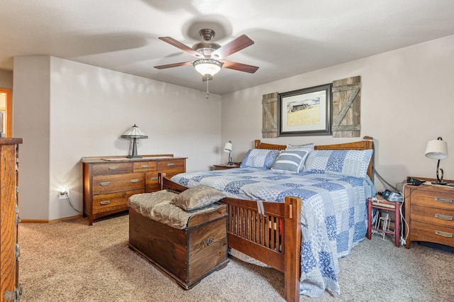 bedroom featuring light colored carpet and ceiling fan